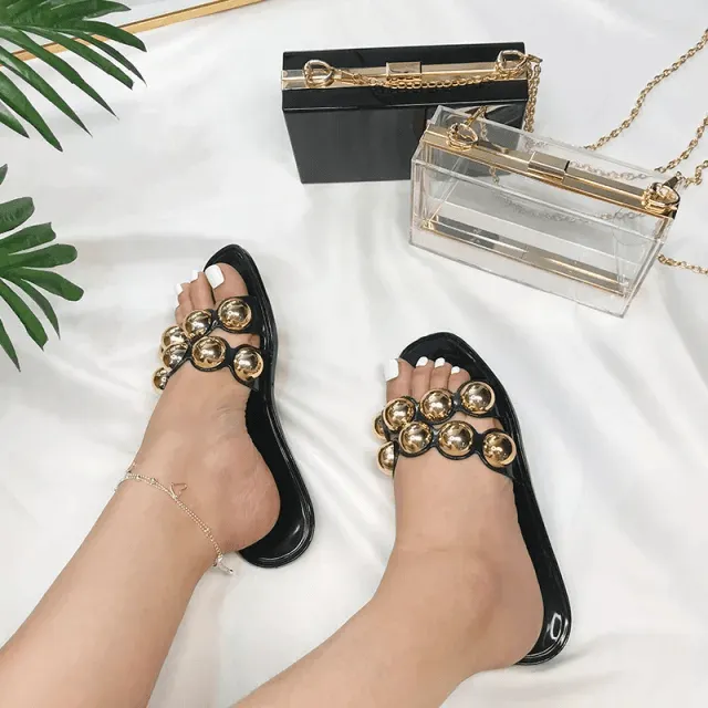 Black jelly sandals with gold studs