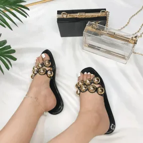 Black jelly sandals with gold studs